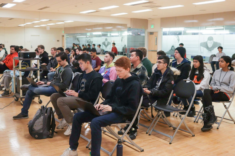 Hackers attending a tech talk
